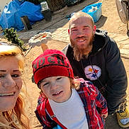Mavrik joined the competition — help win amazing prizes! child, adult, family, outdoor, beanie, plaid_shirt, sippy_cup, smiling, beard, blonde_hair, piercing, hoodie, casual_clothing, backyard, garden_tools, sunlight, dirt_ground, container, plastic_bin, selfie