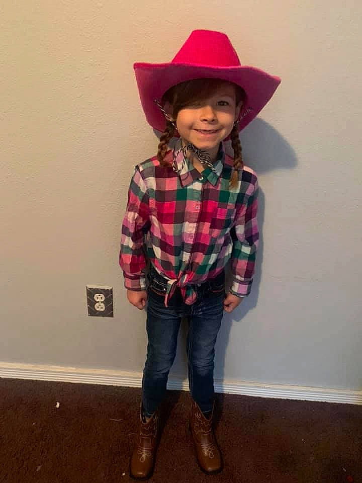 Layla is registered to the contest to win money with this photo: blazer, cap, clothing, collar, dress_shirt, fashion_design, hat, headgear, headwear, human_body, joy, knee, lip, magenta, person, plaid, sleeve, smile, street_fashion, sun_hat