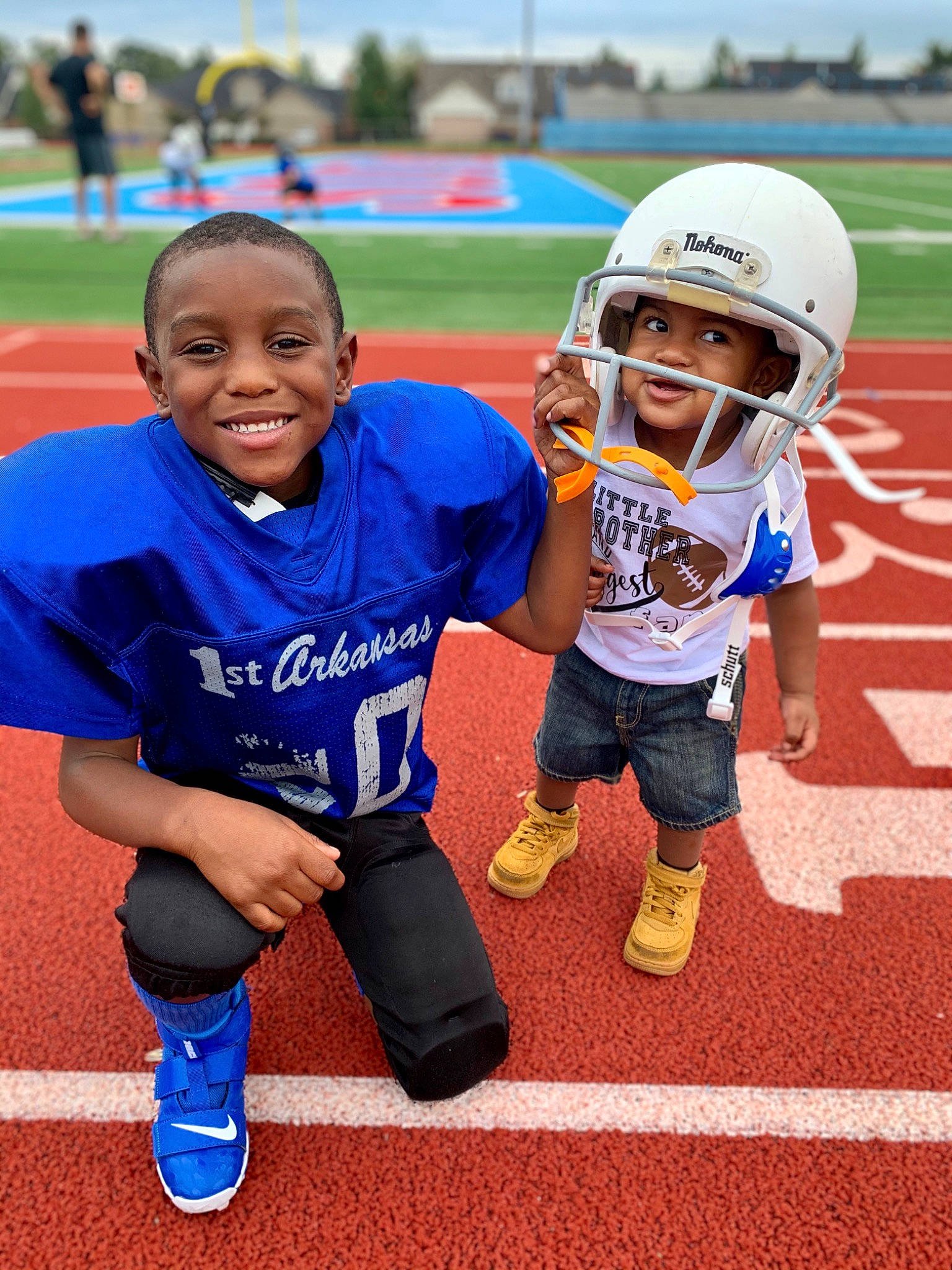 Kainan is registered to the contest to win money with this photo: athletics, championship, child, competition_event, games, headwear, joy, person, player, recreation, running, sport_venue, sports, sports_equipment, sports_gear, stadium, team, team_sport, tournament, track_and_field_athletics