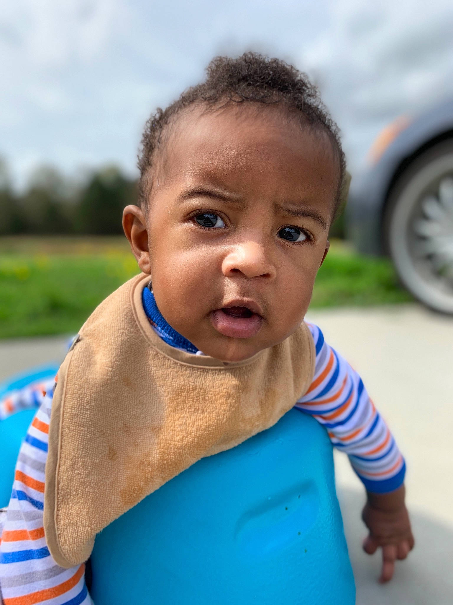 Kainan is registered to the contest to win money with this photo: baby, blue, child, face, forehead, head, male, nose, people, person, skin, smile, toddler, vacation, water