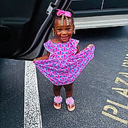 Za Lonnii joined the competition — help win amazing prizes! child, girl, smiling, dress, pink_bow, beads, sandals, flower_sandals, parking_lot, car_door, license_plate, asphalt, white_line, standing, happy, outdoor, person, cute, fashion, accessories