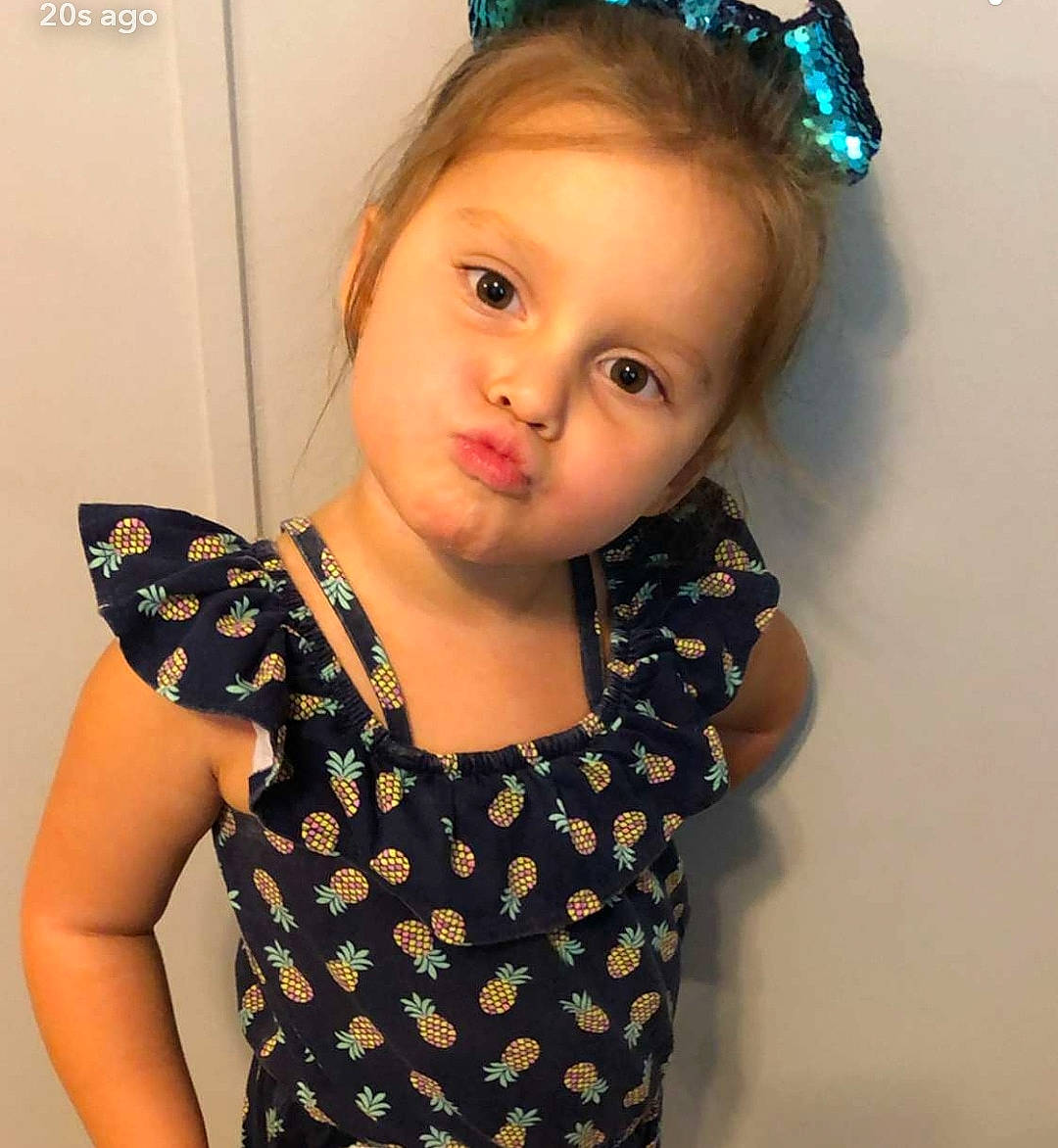 Carlie is registered to the contest to win money with this photo: baby, baby_toddler_clothing, cheek, child, child_model, clothing, design, dress, face, forehead, hair, hair_accessory, head, headband, headgear, lip, pattern, person, polka_dot, toddler