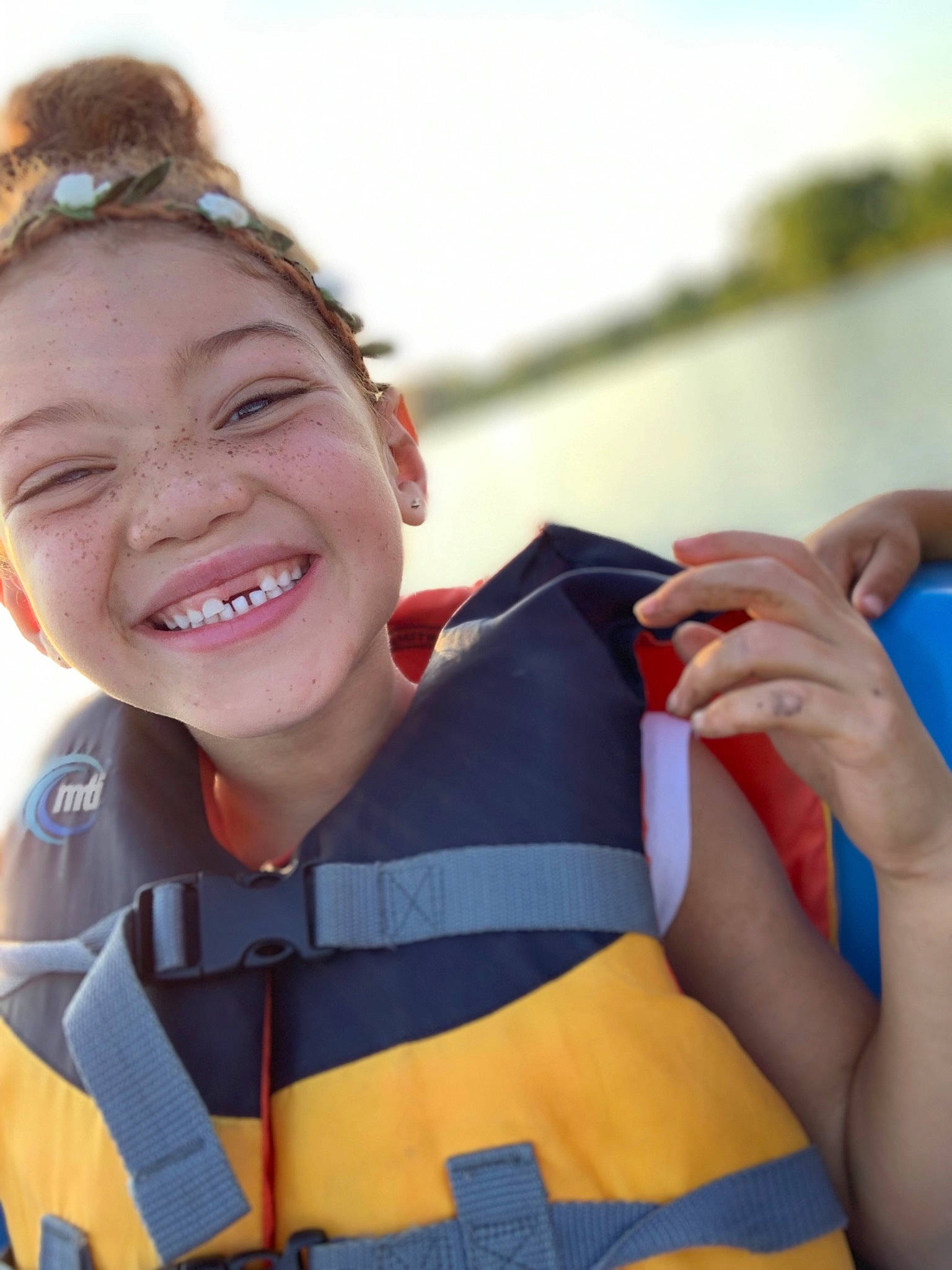 Avaree is registered to the contest to win money with this photo: child, ear, facial_expression, fun, gesture, happy, joy, laugh, leisure, lifejacket, person, recreation, smile, vacation