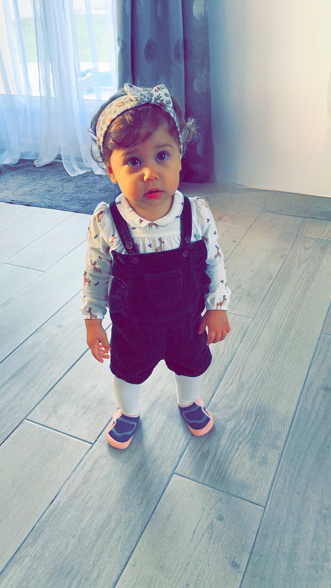 Havana participe au concours pour gagner de l'argent avec cette photo : baby, baby_toddler_clothing, child, face, fashion_accessory, floor, flooring, happy, hardwood, human_leg, metal, pattern, person, purple, shoe, sitting, sleeve, sportswear, t_shirt, toddler