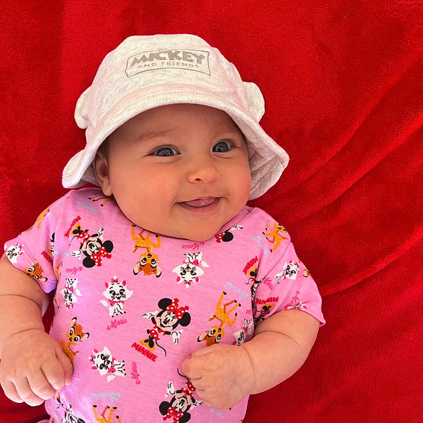 Stefania joined the competition — help win amazing prizes! baby, bodypart, bonnet, cap, clothing, dress, face, finger, hand, happy, hat, head, newborn, person, photography, portrait, sitting, smile, sunhat, t_shirt
