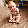 baby, teddy_bear, carpet, toy, child, indoors, curious, cute, playing, soft_toys, carpet_floor, head_tilt, infant, warm_lighting, crawling, floor, pajamas, childhood, home, expression