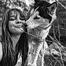 Leïka a rejoint le concours — aidez-le/la à gagner de superbes lots ! affection, animal, black_and_white, candid, close_up, dog, expression, face, friendship, happy, husky, long_hair, nature, outdoor, pet, portrait, rock, smiling, tree, woman