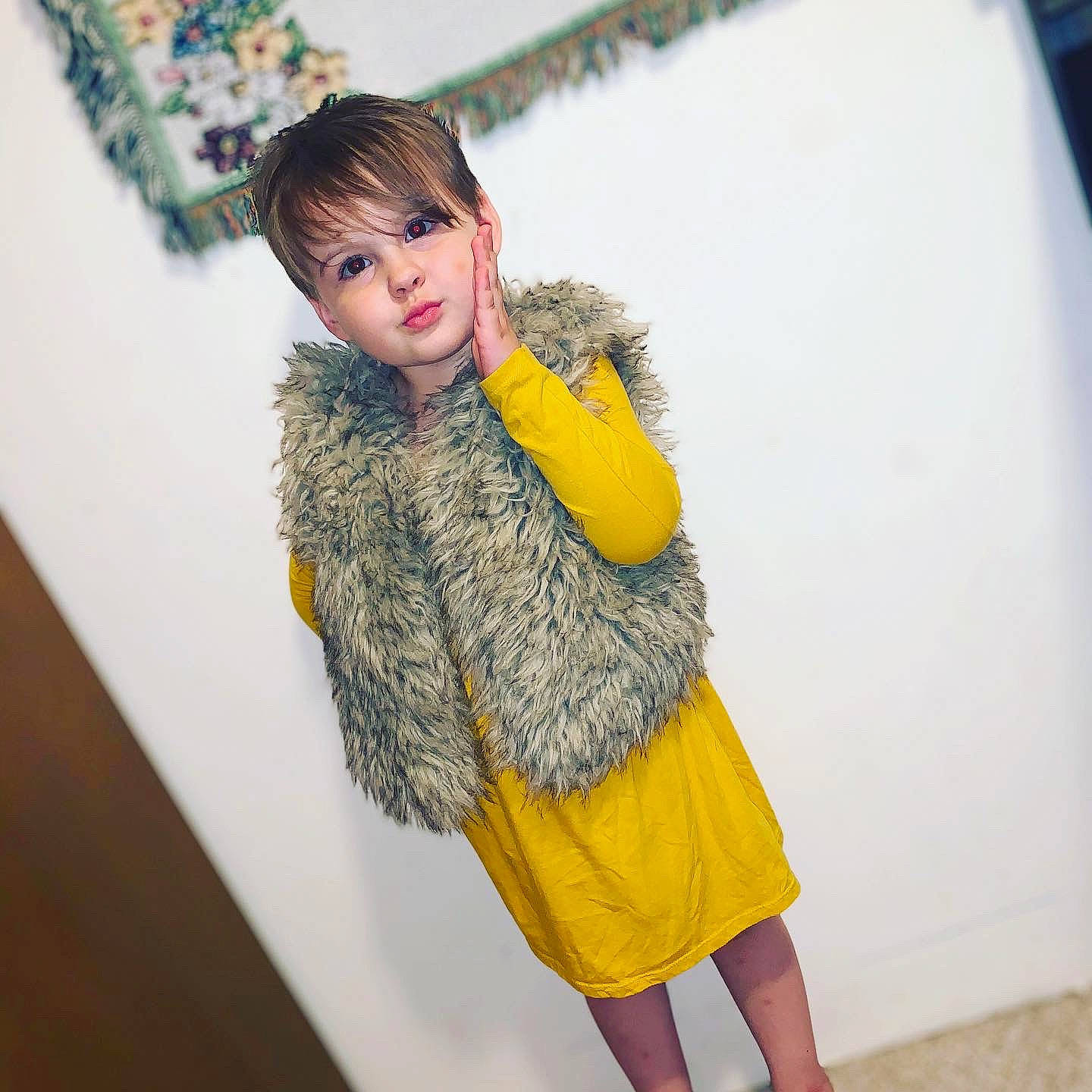 Evelynne is registered to the contest to win money with this photo: blond, denim, fashion_design, flooring, fun, fur_clothing, hair, headgear, human_leg, jacket, joint, knee, long_hair, neck, pattern, person, skin, sleeve, standing, thigh