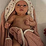 baby, infant, towel, blanket, cloth, face, skin, lying_down, newborn, cute, soft_texture, white_background, knitted_booties, pink, hood, child, small_hands, wrapped, indoors, portrait