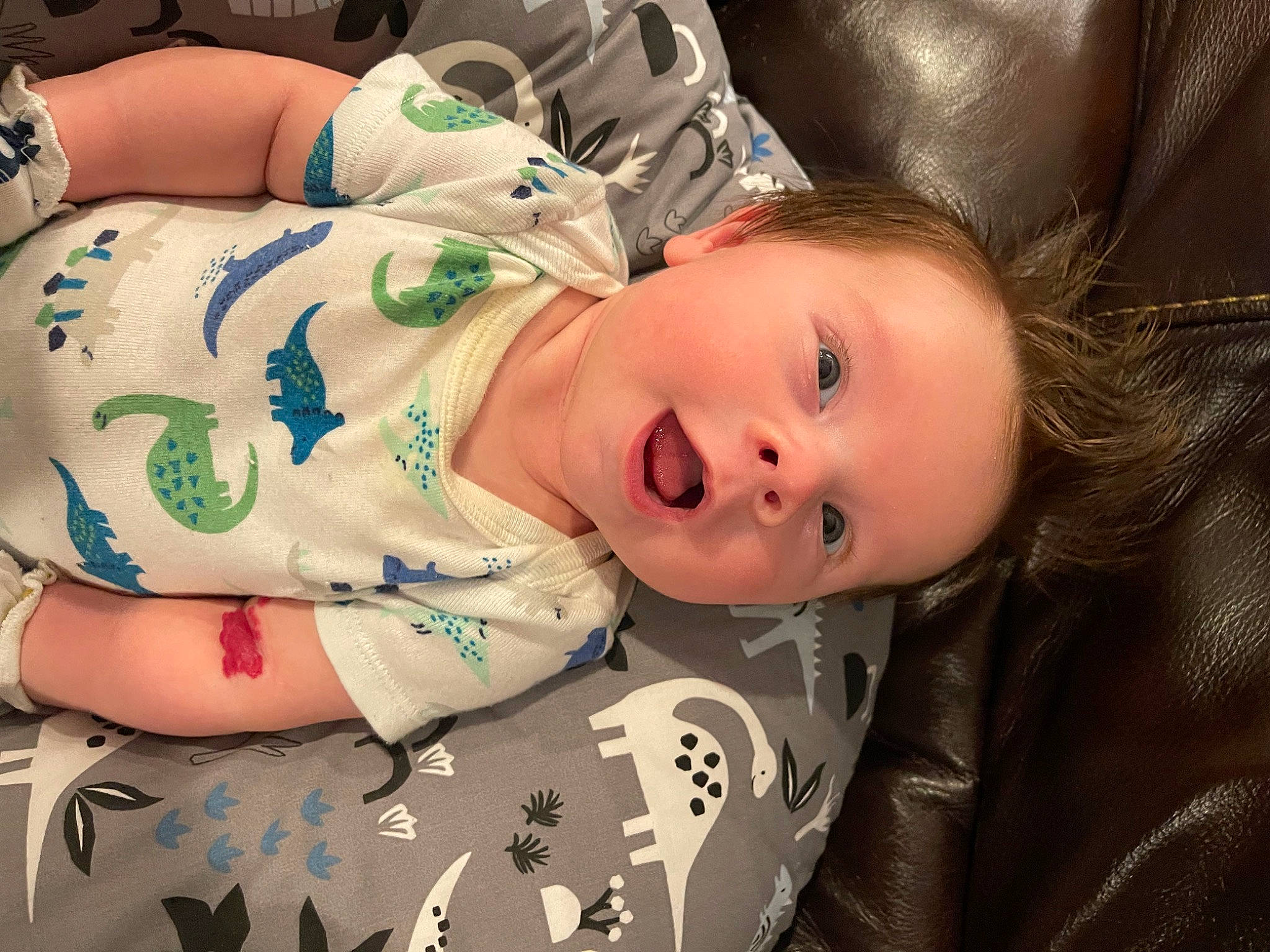 Maddox is registered to the contest to win money with this photo: baby, baby_toddler_clothing, cheek, child, comfort, eyelash, fur, hat, lip, mouth, nose, pattern, person, portrait_photography, sitting, skin, sleeve, textile, toddler, wood