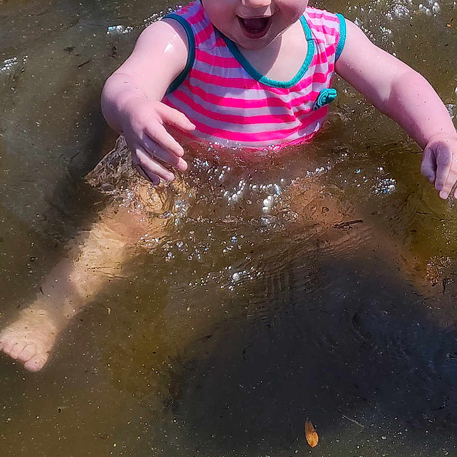 Raelynn is registered to the contest to win money with this photo: baby, beach, clothing, coast, face, head, leisureactivities, nature, outdoors, person, photography, portrait, sea, shoreline, sport, summer, swimming, swimwear, water, watersports