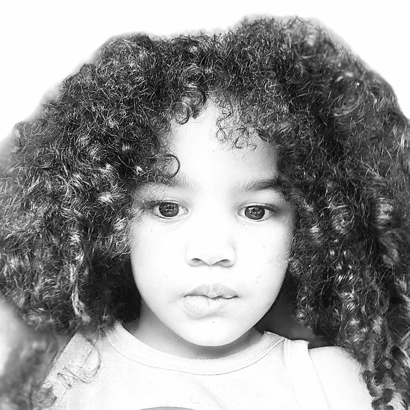 Dezariah joined the competition — help win amazing prizes! child, portrait, face, curly_hair, black_and_white, closeup, serious, looking_at_camera, eyes, nose, mouth, shirt, rainbow, indoor, headshot, photography, young_person, hair, monochrome, safe