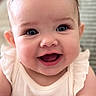 baby, smiling, blue_eyes, infant, cute, happy, portrait, child, sitting, white_clothing, soft_fabric, closeup, indoors, cute_expression, cheerful, skin, face, person, young_child, adorable