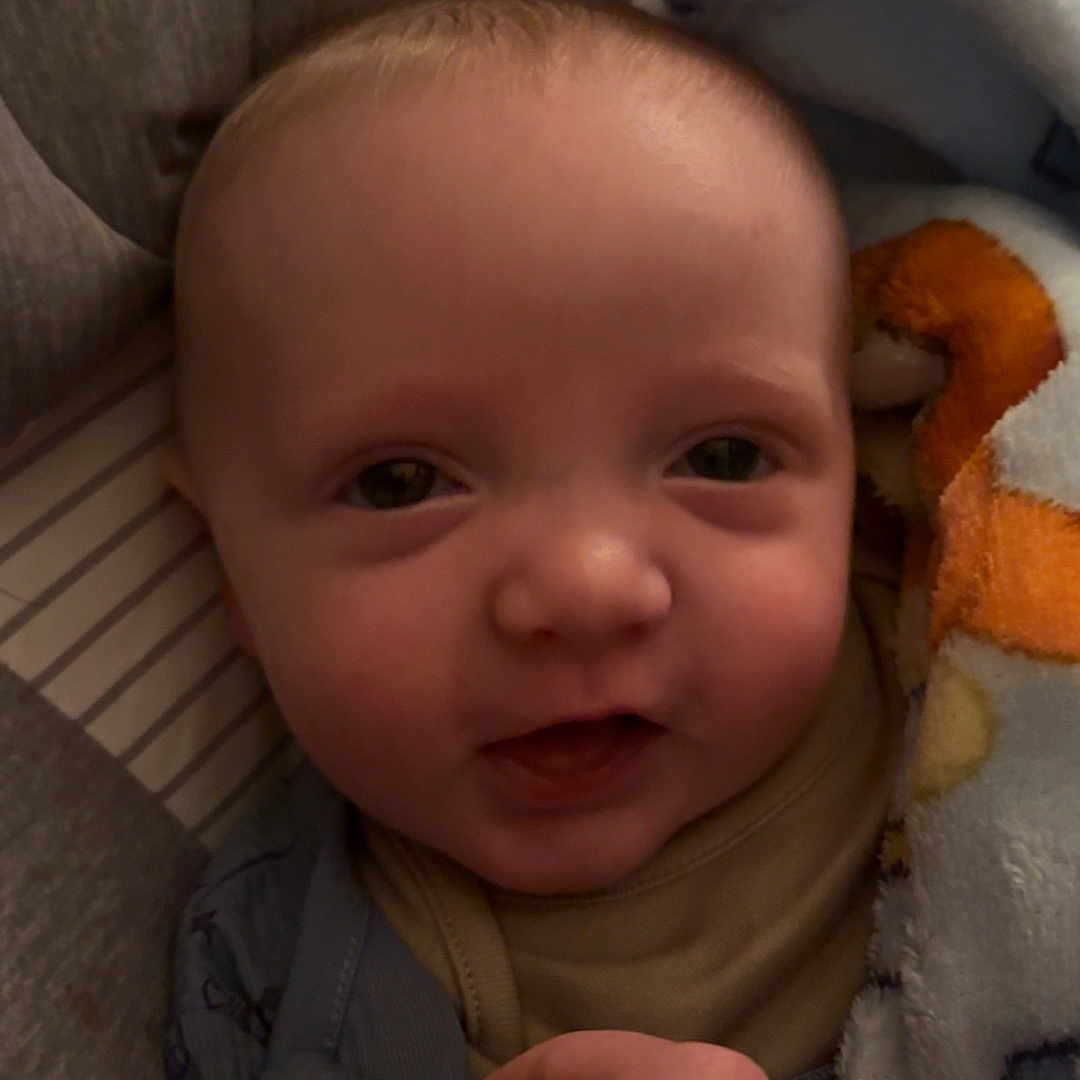 Anthony-James joined the competition — help win amazing prizes! baby, beverage, blanket, bodypart, coffee, coffeecup, couch, cup, ear, face, finger, furniture, hand, head, homedecor, linen, newborn, person, photography, portrait