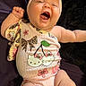 Blayre is registered to the contest to win money with this photo: baby, infant, smiling, happy, cute, hello_kitty, headband, clothing, pink, lying_down, arm, hand, face, skin, child, portrait, indoors, soft_toys, fabric, closeup
