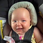 Blayre joined the competition — help win amazing prizes! baby, infant, car_seat, child, smile, happy, seatbelt, straps, face, head_support, clothing, yellow, pink, pattern, cute, closeup, portrait, safety, indoor, person