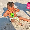 toddler, child, beach, sand, toy, bucket, playing, sunlight, shadow, diaper, curly_hair, outdoor, summer, bare_chest, barefoot, sitting, skin, daytime, fun, exploring