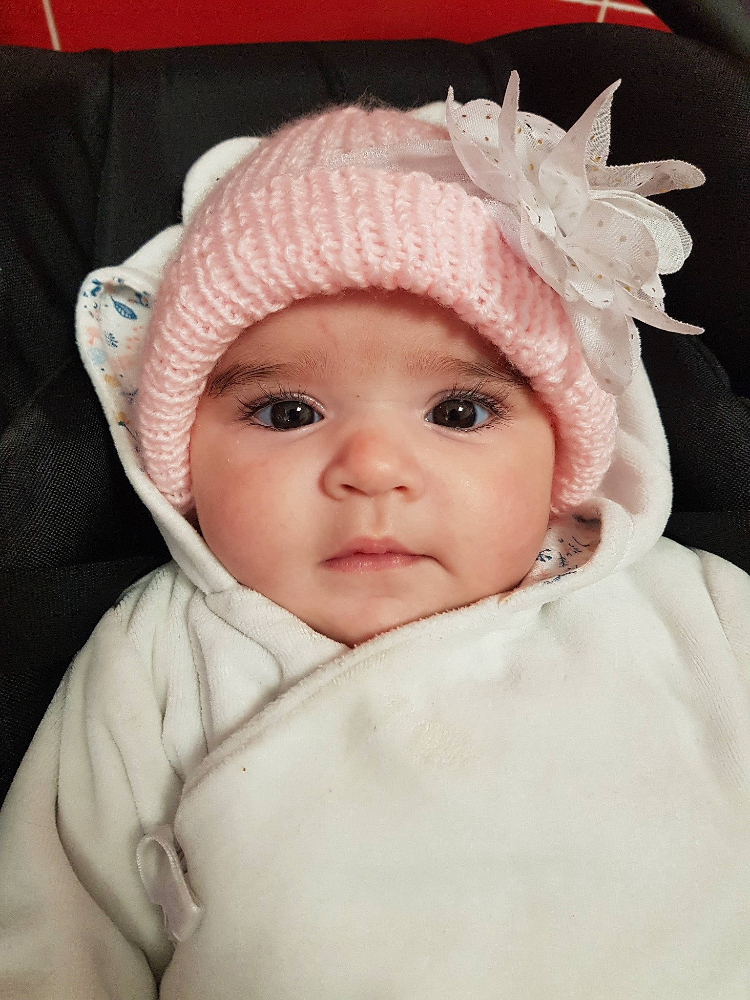Maëlys a rejoint le concours — aidez-le/la à gagner de superbes lots ! baby, bonnet, cap, cheek, child, ear, eye, face, fashion_accessory, fur, hat, head, headgear, headwear, lip, nose, person, pink, skin, smile