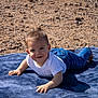 Miles joined the competition — help win amazing prizes! baby, child, infant, smiling, outdoor, rocky_ground, blue_blanket, white_shirt, blue_jeans, crawling, happy, young_child, portrait, sunlight, nature, casual_clothing, baby_face, one_person, daylight, playful