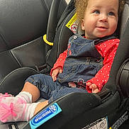 Serinity joined the competition — help win amazing prizes! baby, car, car_interior, carseat, clothing, coat, cushion, face, happy, head, homedecor, jacket, jeans, pants, person, photography, portrait, smile, transportation, vehicle