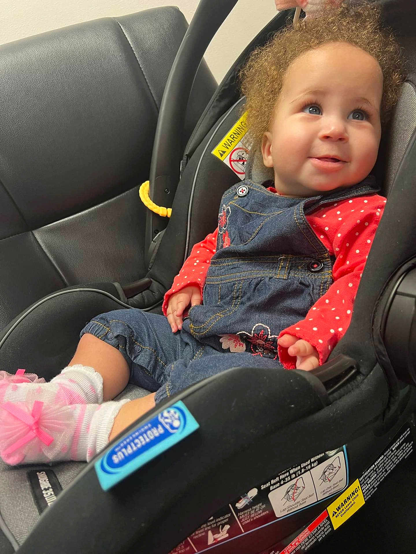 Serinity joined the competition — help win amazing prizes! baby, car, car_interior, carseat, clothing, coat, cushion, face, happy, head, homedecor, jacket, jeans, pants, person, photography, portrait, smile, transportation, vehicle