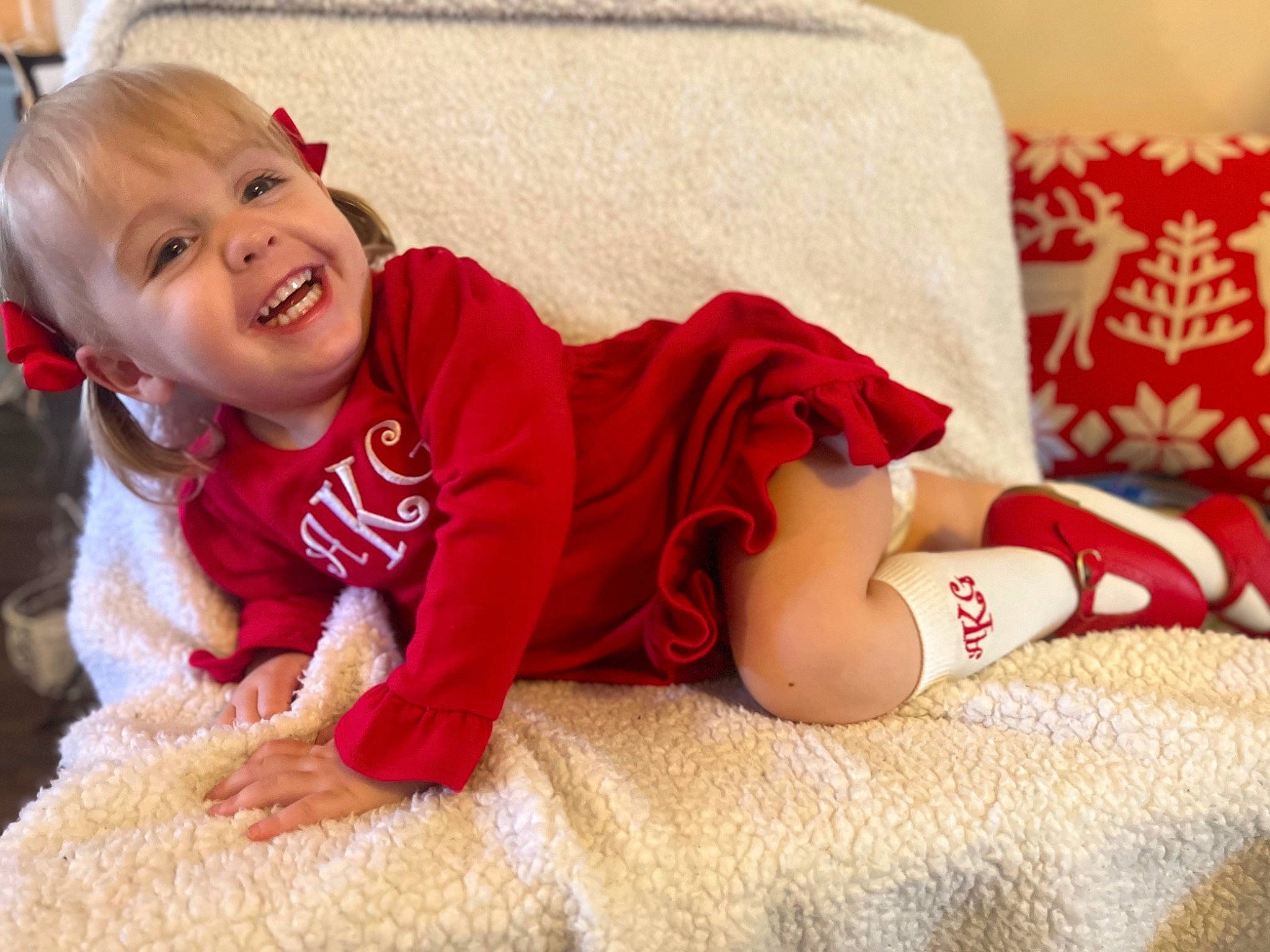 Alexandria joined the competition — help win amazing prizes! baby, baby_toddler_clothing, carmine, child, comfort, flooring, fur, happy, human_leg, knee, linens, pattern, person, room, sitting, skin, sleeve, smile, sock, thigh