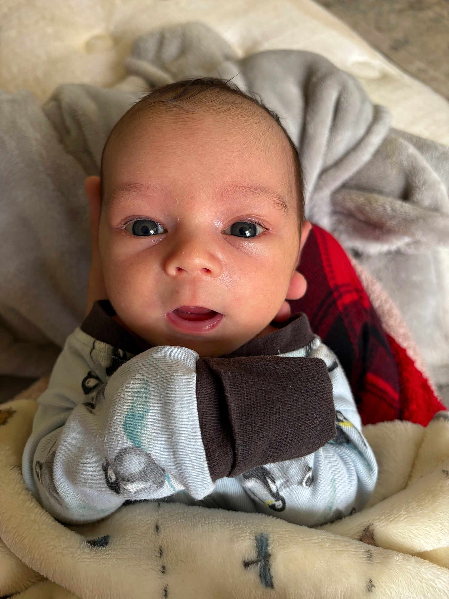 Noah-Jude joined the competition — help win amazing prizes! baby, infant, face, eyes, blanket, mittens, clothing, person, portrait, cute, newborn, skin, head, expression, indoor, warm, soft, comfort, closeup, human