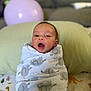 newborn, baby, blanket, wrapped, face, infant, couch, pillow, balloon, indoor, soft, cute, child, portrait, expression, home, comfort, pattern, resting, young