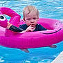 toddler, child, pool, water, inflatable, flamingo, float, swimming, summer, outdoor, wet_hair, blue_shirt, reflection, thinking, cute, baby, fun, leisure, vacation, play