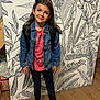 child, girl, denim_jacket, pink_shirt, leggings, pink_sneakers, backpack, long_hair, headband, smiling, indoor, wooden_floor, artistic_wall, leaf_pattern, standing, casual_clothing, happy, portrait, fashion, youth
