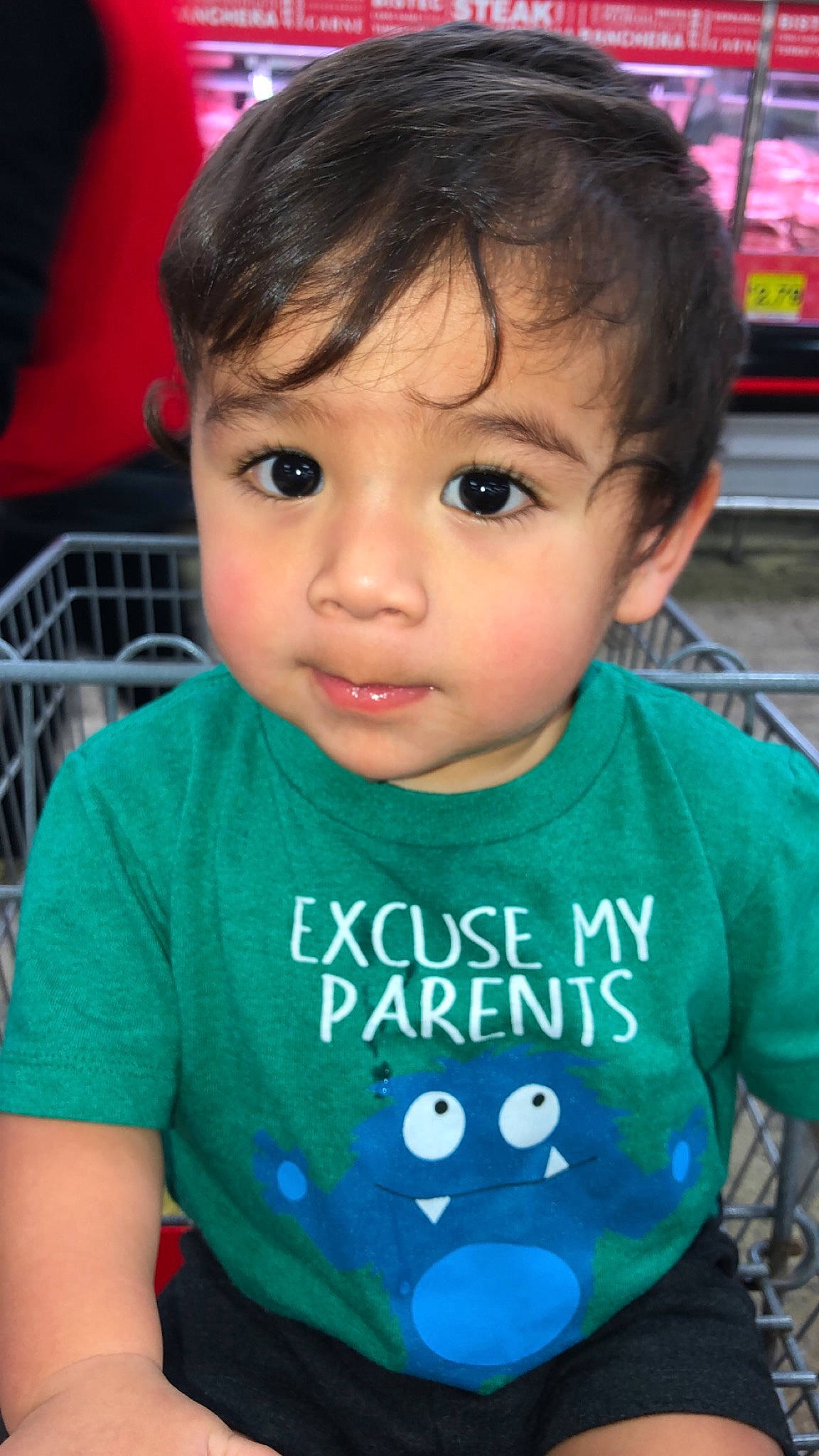 Damian is registered to the contest to win money with this photo: baby_toddler_clothing, black, cheek, chin, eyelash, face, facial_expression, forehead, hairstyle, iris, lip, mammal, mouth, nose, organ, person, product, skin, sleeve, vertebrate