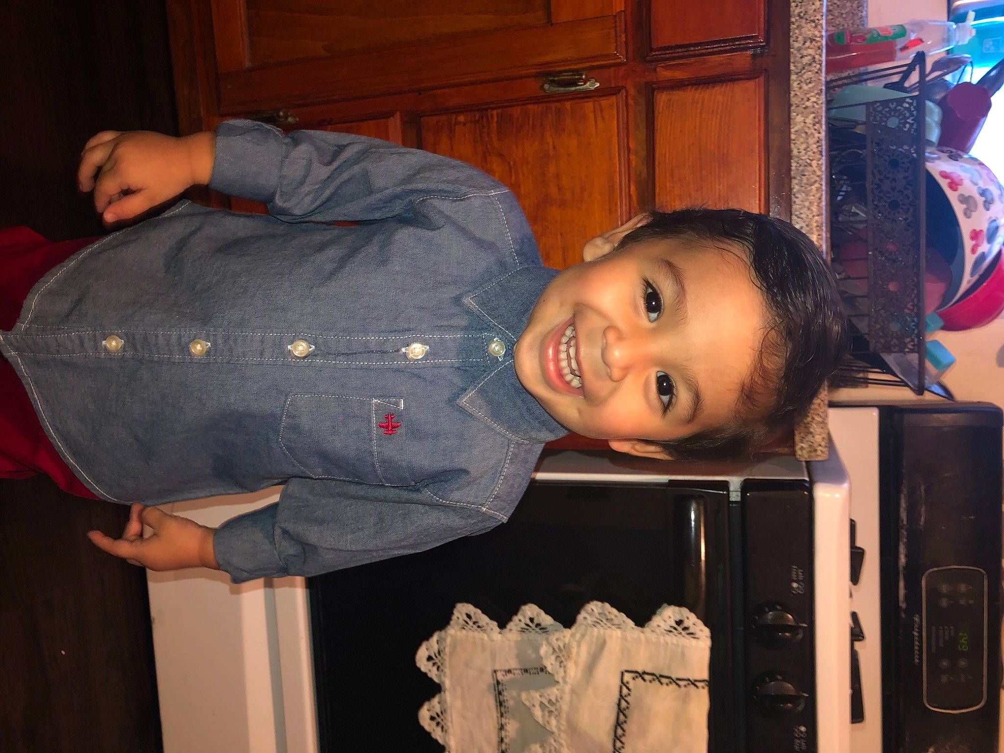 Damian is registered to the contest to win money with this photo: baby_toddler_clothing, cabinetry, cheek, child, electric_blue, fun, happy, iris, joy, machine, mouth, nose, person, room, sitting, smile, standing, toddler, wood