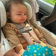 Myles joined the competition — help win amazing prizes! baby, car_seat, child, infant, seatbelt, car, window, toy, polka_dots, clothing, smile, hair, safety, interior, seat, child_safety, cute, young_child, car_interior, child_restraint