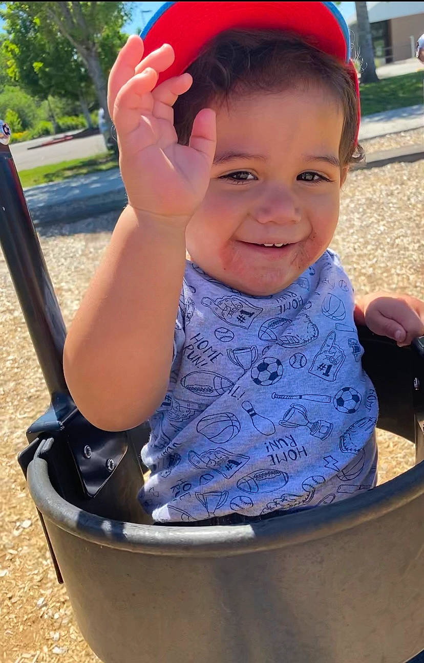 Bryan joined the competition — help win amazing prizes! baseball_cap, child, cool, facial_expression, finger, fun, grass, hand, happy, joy, leisure, person, pink, product, public_space, recreation, skin, smile, standing, toddler