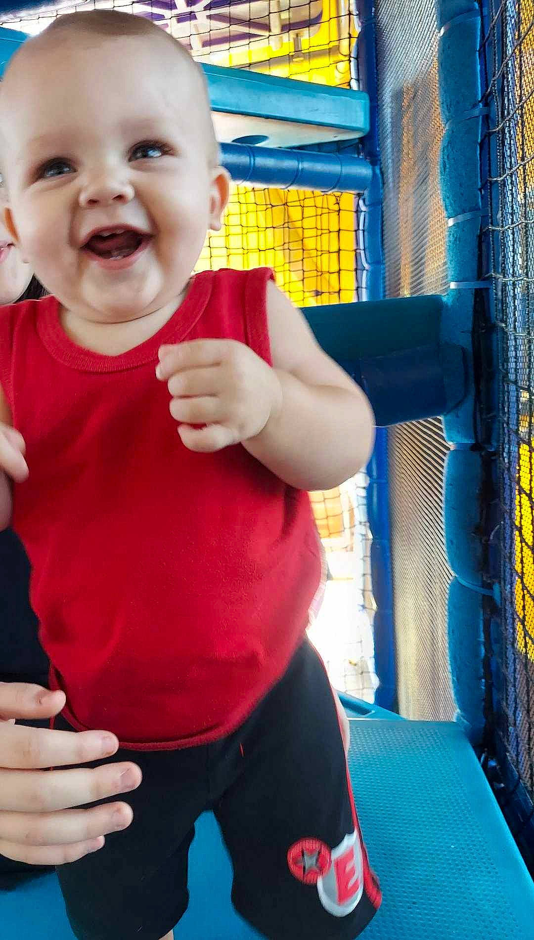 Lachlan joined the competition — help win amazing prizes! baby, baby_toddler_clothing, blue, chin, finger, fun, gesture, hand, happy, mouth, nose, organ, person, skin, sleeve, smile, standing, thigh, thumb, toddler