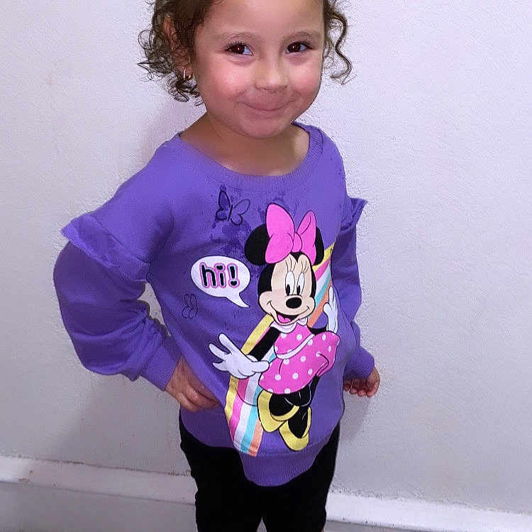 Ivory is registered to the contest to win money with this photo: applique, child, clothing, face, female, footwear, girl, head, hosiery, longsleeve, pants, pattern, person, photography, portrait, purple, shoe, sleeve, sock, t_shirt