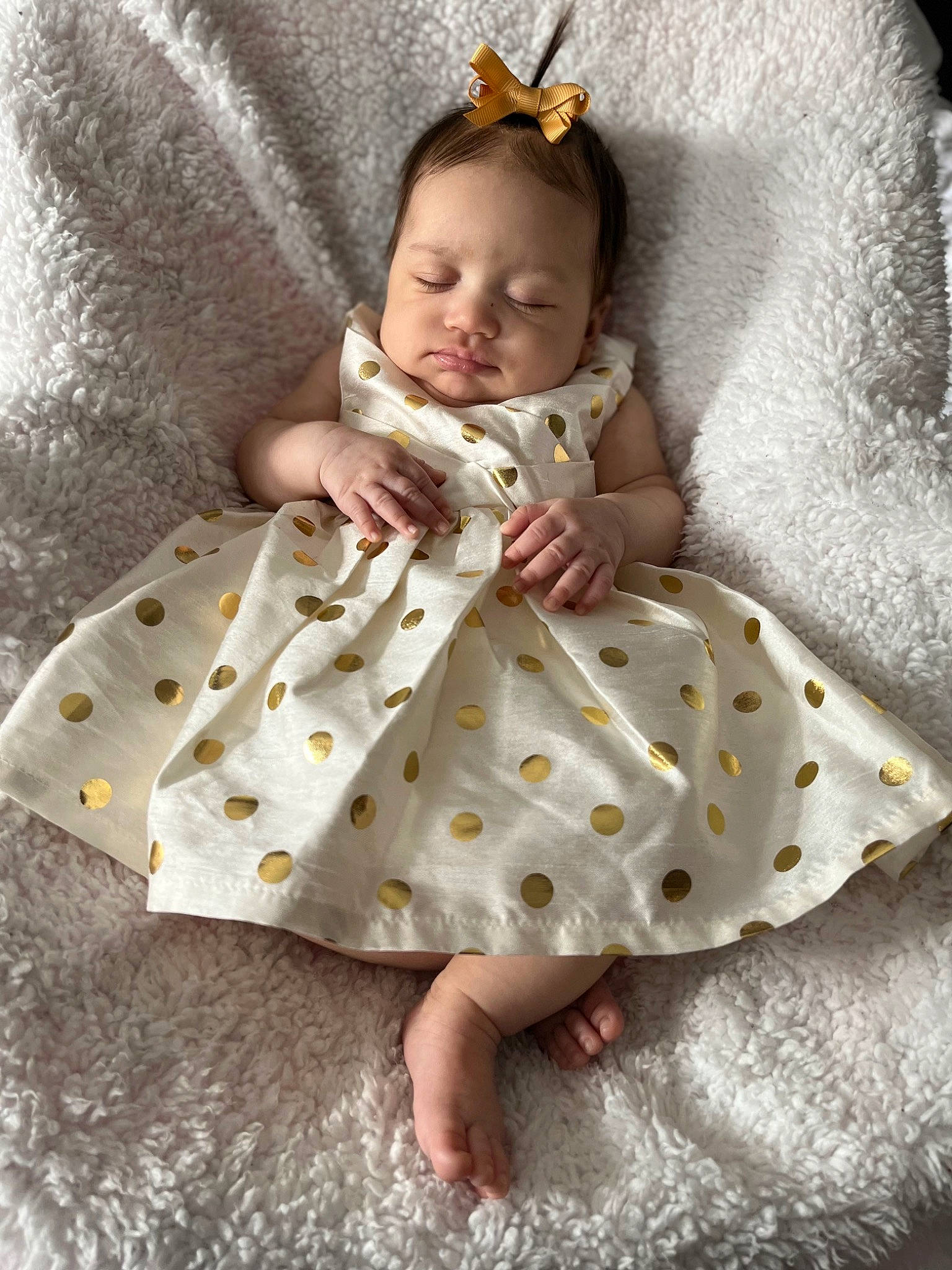 Isabelle is registered to the contest to win money with this photo: baby, baby_toddler_clothing, barefoot, child, comfort, day_dress, dress, eye, face, flash_photography, hairstyle, head, headgear, human_body, jewellery, linens, person, skin, sleeve, textile