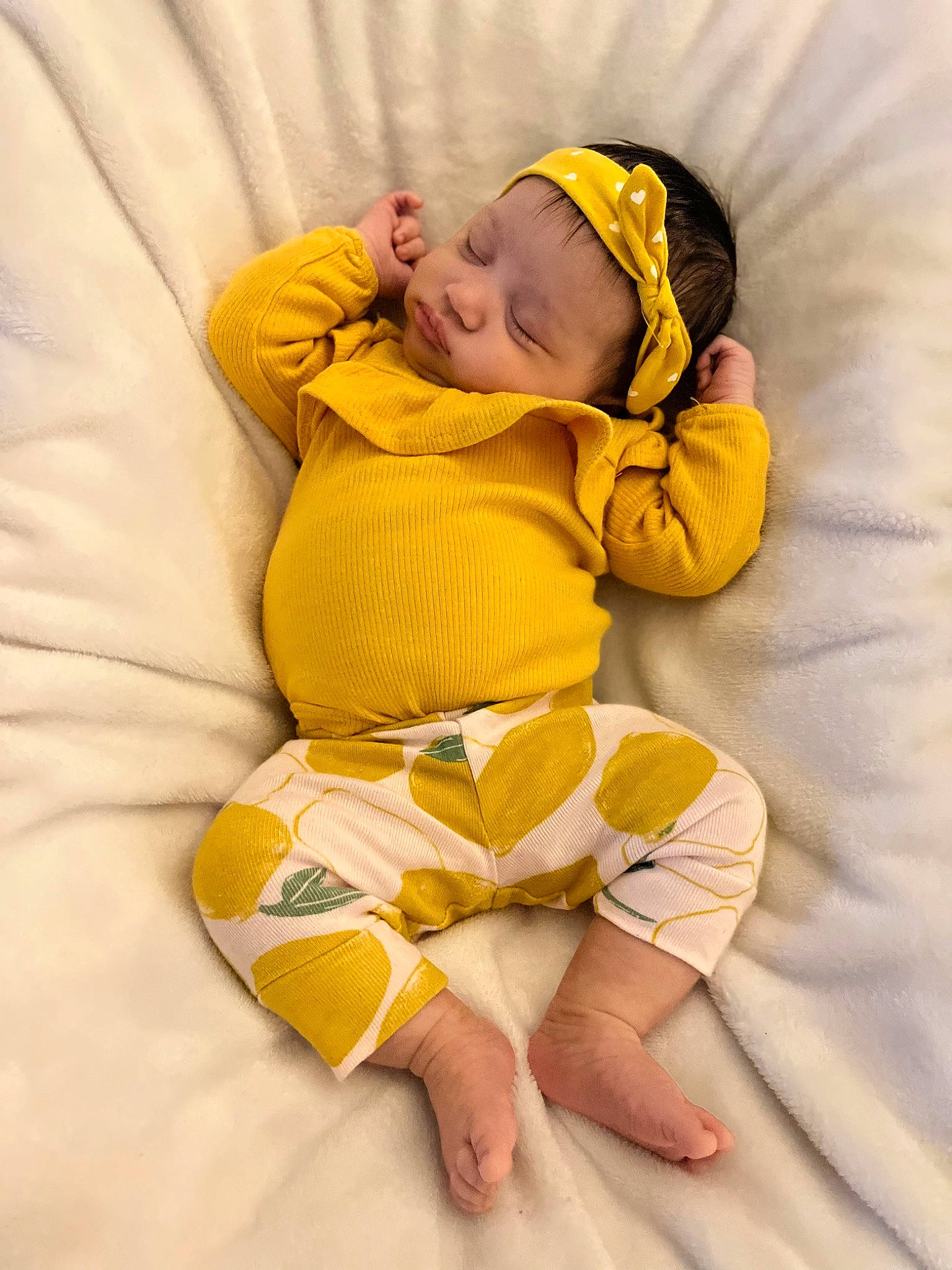 Isabelle is registered to the contest to win money with this photo: abdomen, arm, baby, baby_sleeping, baby_toddler_clothing, barefoot, child, comfort, face, foot, happy, leg, linens, orange, person, sleeve, stomach, textile, thigh, toddler