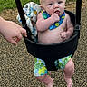 baby, child, swing, playground, outdoor, grass, hand, bib, shorts, barefoot, infant, seat, play, summer, park, person, cute, expression, skin, fun