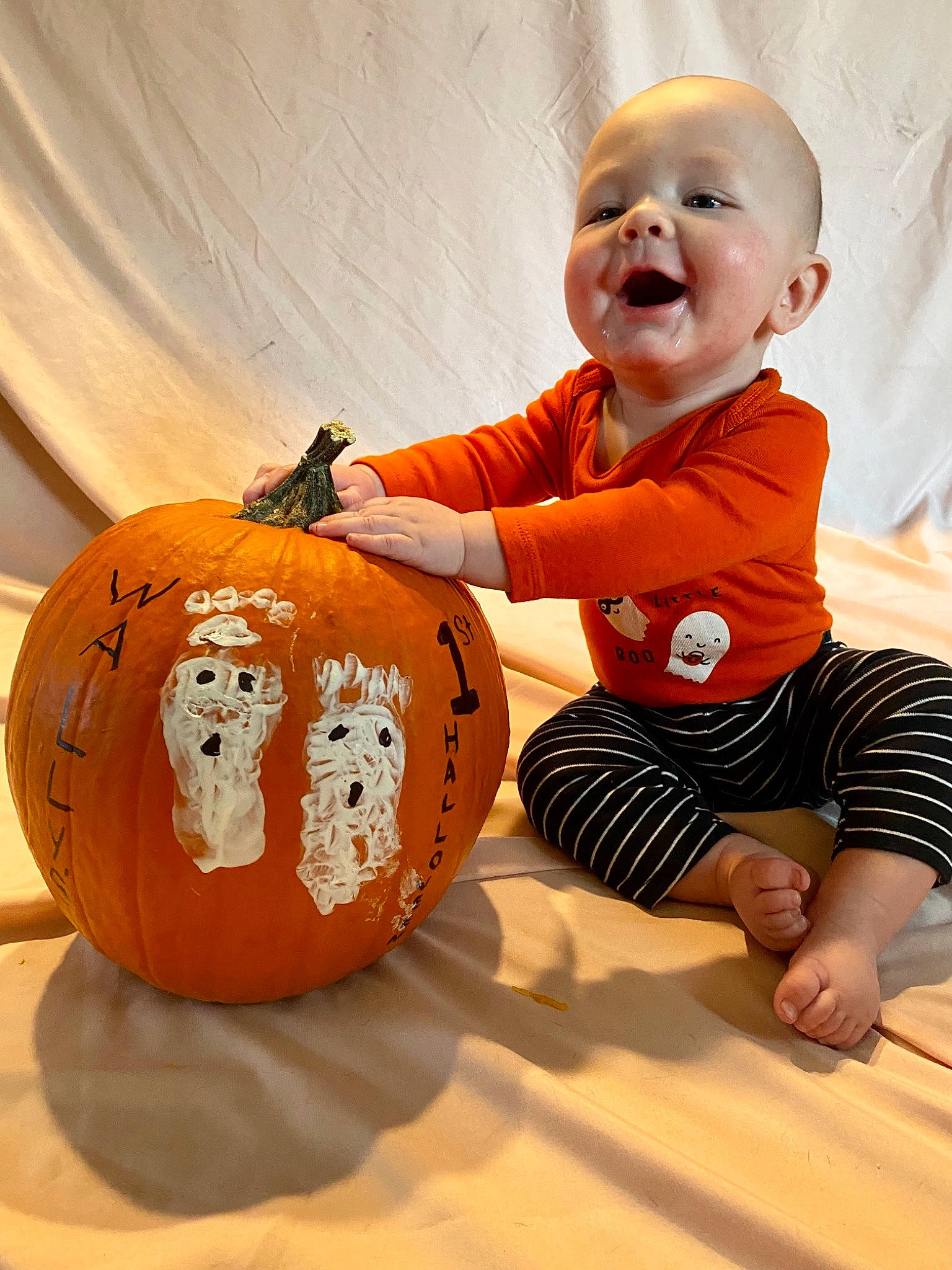 Wallace is registered to the contest to win money with this photo: art, baby, baby_toddler_clothing, calabaza, cucurbita, fun, gourd, happy, jack_o_lantern, natural_foods, orange, person, plant, pumpkin, sleeve, smile, squash, t_shirt, toddler, vegetable