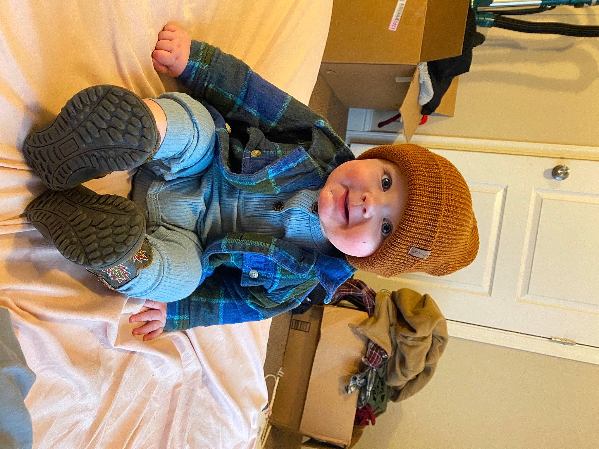 Wallace is registered to the contest to win money with this photo: animation, baby, backpack, bag, box, child, comfort, fur, hat, headwear, luggage_and_bags, machine, person, plush, room, shipping_box, stuffed_toy, toy