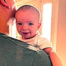 Hudson joined the competition — help win amazing prizes! baby, child, smile, face, person, adult, cap, shoulder, window, light, indoor, happy, cute, skin, hair, clothing, holding, portrait, warm_light, family
