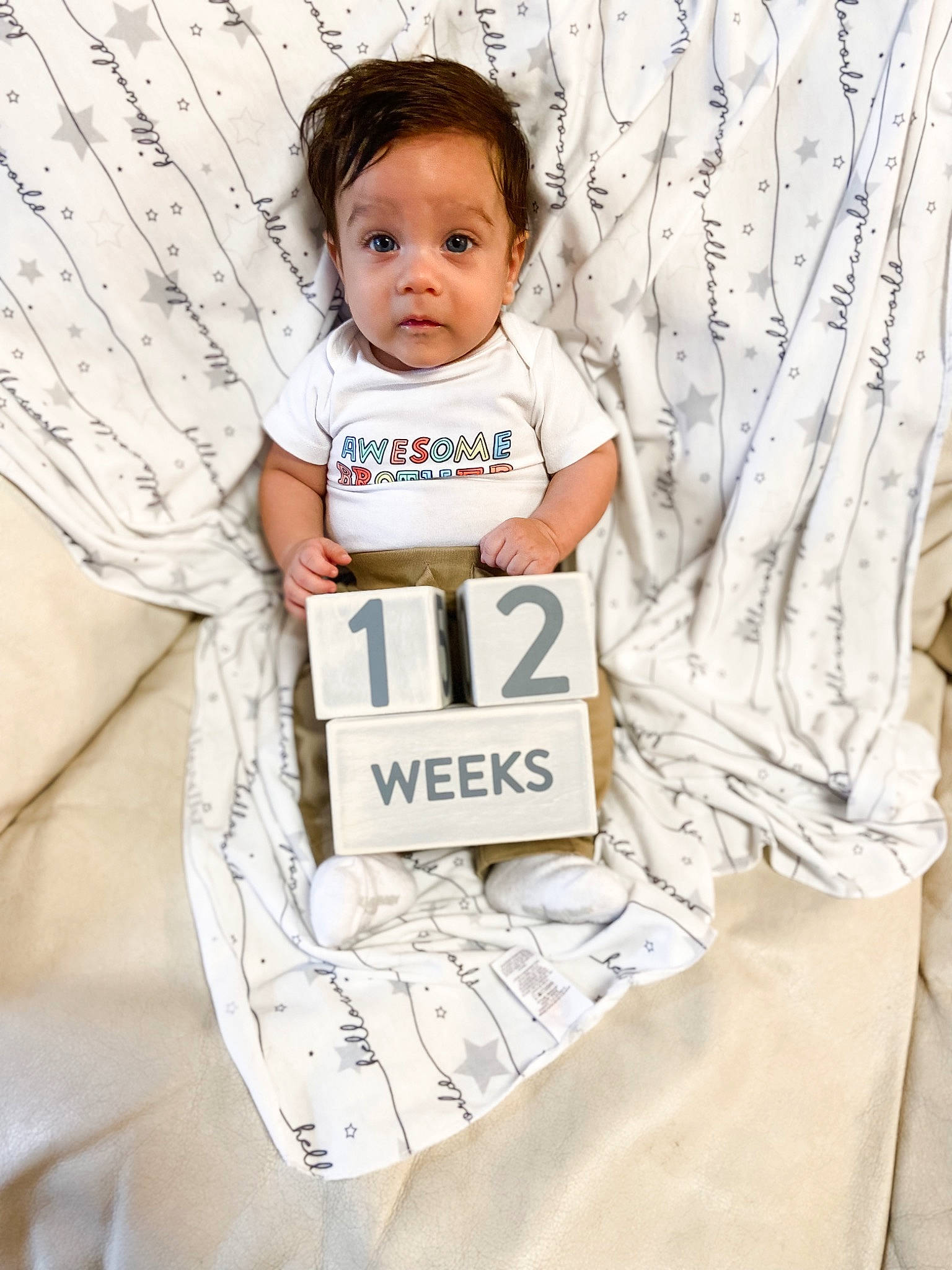 Cristian is registered to the contest to win money with this photo: baby, baby_products, baby_safety, baby_toddler_clothing, child, curtain, face, font, happy, linens, outerwear, pattern, peach, person, product, room, sitting, sleeve, t_shirt, textile