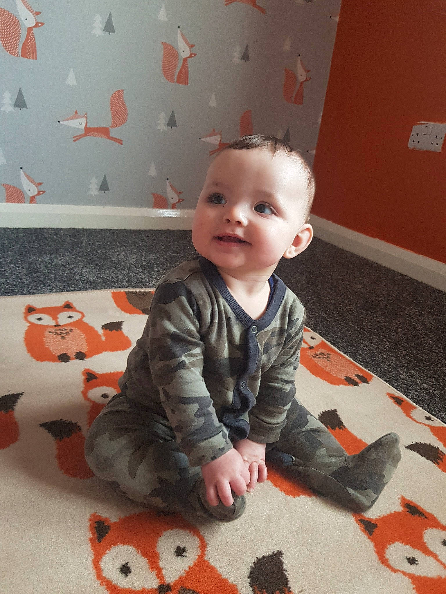 Theodore joined the competition — help win amazing prizes! baby, carpet, cheek, child, crawling, floor, flooring, head, joy, orange, person, play, room, sitting, smile, toddler