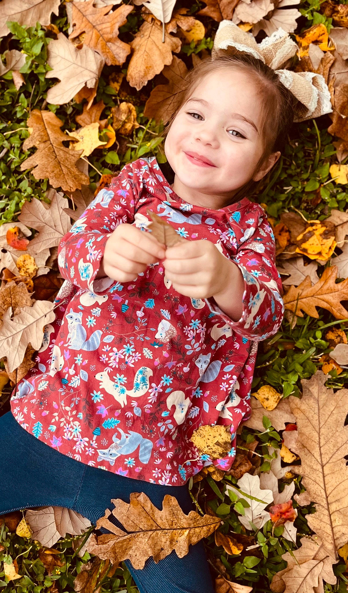 Adeline is registered to the contest to win money with this photo: adaptation, baby_toddler_clothing, botany, child, dress, face, facial_expression, grass, happy, joy, leaf, nature, orange, people, people_in_nature, person, plant, sleeve, smile, toddler