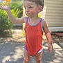 Anthony is registered to the contest to win money with this photo: blue_eyes, blurred_background, casual_clothing, child, curly_hair, daylight, expression, garden, orange_onesie, outdoor, person, portrait, sidewalk, skin, standing, summer, sunlight, toddler, waving, young_child