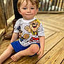 Anthony joined the competition — help win amazing prizes! child, toddler, barefoot, blue_eyes, rosy_cheeks, paw_patrol, tshirt, shorts, wooden_deck, sitting, curious, smile, outdoor, person, cute, casual_clothing, daylight, skin, hair, face