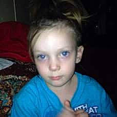 Jayliyn is registered to the contest to win money with this photo: cheek, child, cool, ear, electric_blue, eyebrow, eyelash, forehead, fun, happy, jaw, mouth, nose, person, portrait_photography, sitting, smile, t_shirt, thumb, toddler