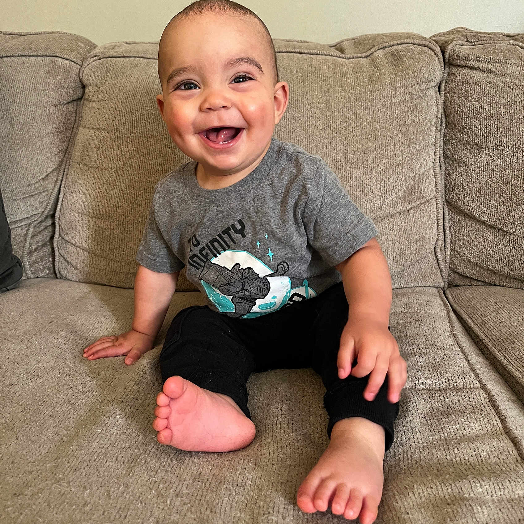Matthias joined the competition — help win amazing prizes! architecture, baby, babylaughing, building, clothing, couch, cushion, face, furniture, happy, head, homedecor, indoors, pants, person, photography, portrait, sitting, smile, t_shirt