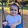 Juliet joined the competition — help win amazing prizes! toddler, child, swing, playground, park, autumn, trees, sunlight, smiling, outdoor, play, fun, happy, clothing, short_sleeve, hair_tie, nature, daytime, baby, person